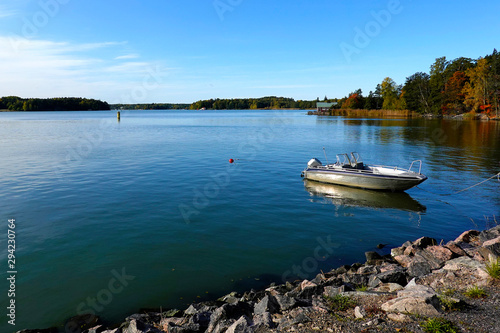 Ruissalo island, turku, Finland. Beautiful seascape with calm sea and moored motor boat on autumn.