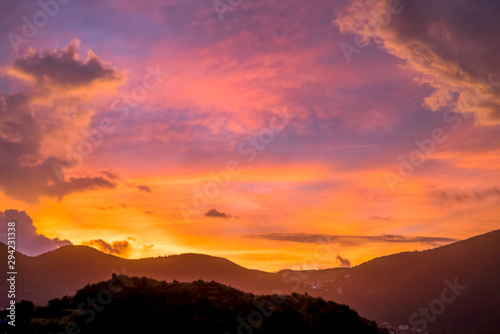 Sun setting during blue hour over hills and mountains