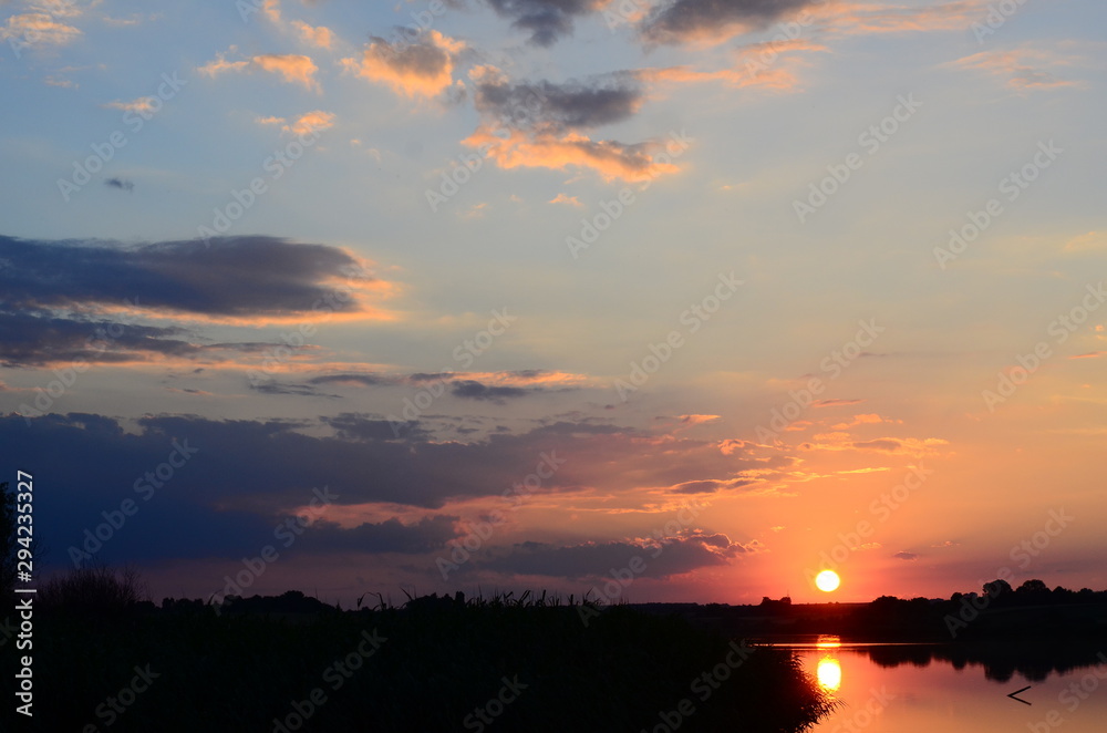 Sunset grass on river sunset landscape