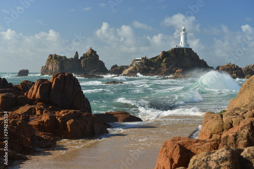 La Corbiere point, Jersey, U.K. Lighthouse in Autumn stormy weather.