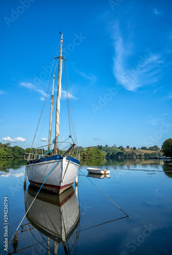 Boat moored in cove near Dittisham, Devon, United Kingdom photo