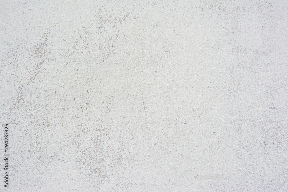 Concrete wall texture with small cracks carelessly painted with white paint Concrete wall texture with small cracks carelessly painted with white paint