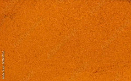 Turmeric spice making a background pattern