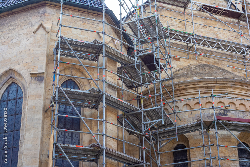 Scaffolding near the old cathedral installed for reconstruction and repair