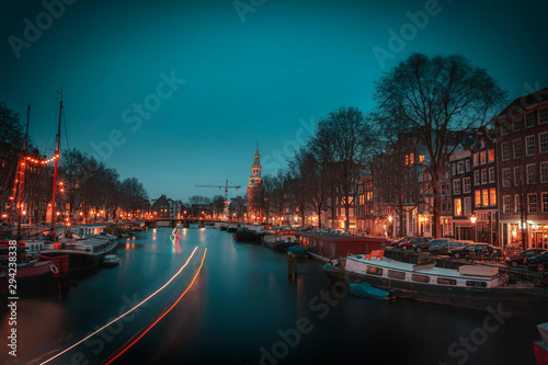 Old Flats in a line from Amsterdam With Trendy Colors During Twilight