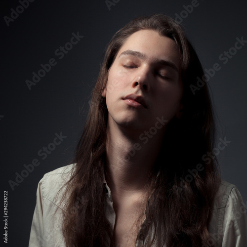 Portrait of young man with closed eyes. © Dima Aslanian