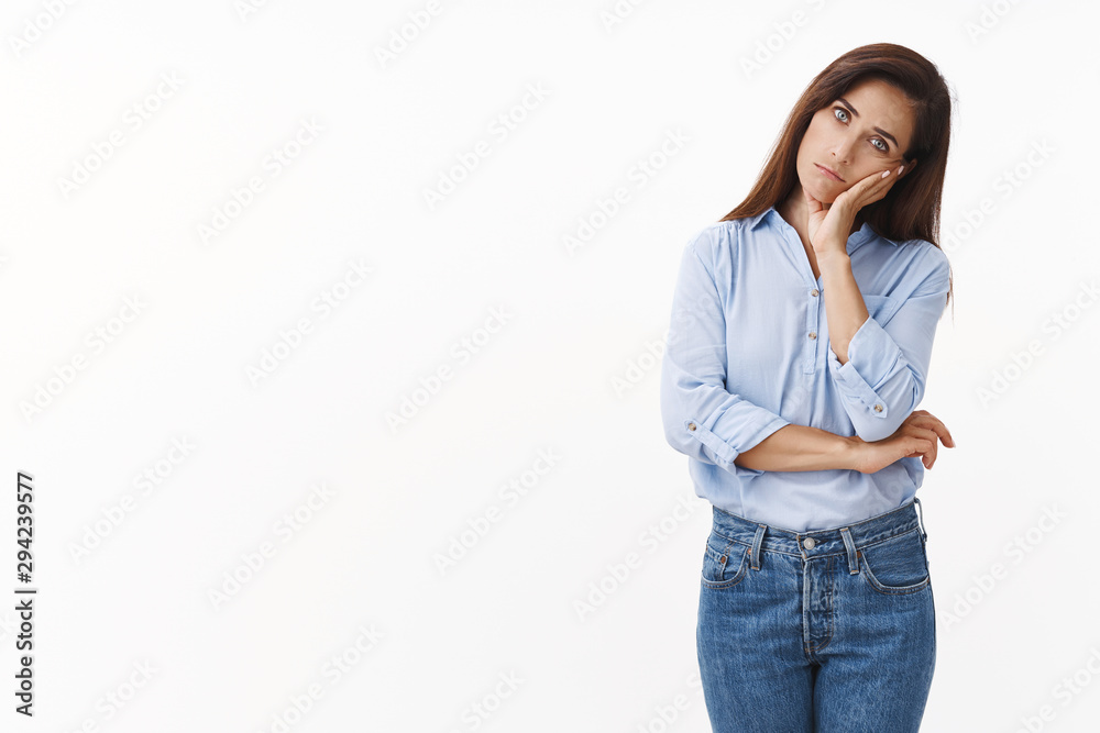 Gloomy sad caucasian female housewife troubled, stand uneasy lean on tattooed hand, look annoyed tired, drained working late, stare bored indifferent camera, stand white background irritated Gloomy sad caucasian female housewife troubled, stand uneasy lean on tattooed hand, look annoyed tired, drained working late, stare bored indifferent camera, stand white background irritated