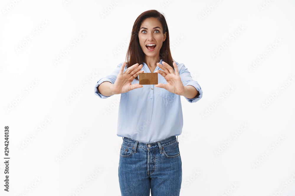 Excited amused middle-aged woman smiling broadly show credit card, recommend awesome bank opportunity, open finance account, start saving money, put cash deposit, shopping, look thrilled camera Excited amused middle-aged woman smiling broadly show credit card, recommend awesome bank opportunity, open finance account, start saving money, put cash deposit, shopping, look thrilled camera