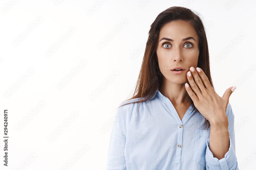Ambushed speechless brunette female office worker receive unexpected promotion, surprising news, gasping amazed stunned, stare camera wondered impressed, touch face, white background Ambushed speechless brunette female office worker receive unexpected promotion, surprising news, gasping amazed stunned, stare camera wondered impressed, touch face, white background