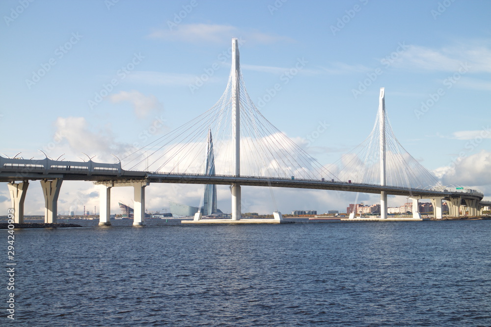 Cable-stayed bridge over a large river on a sunny day