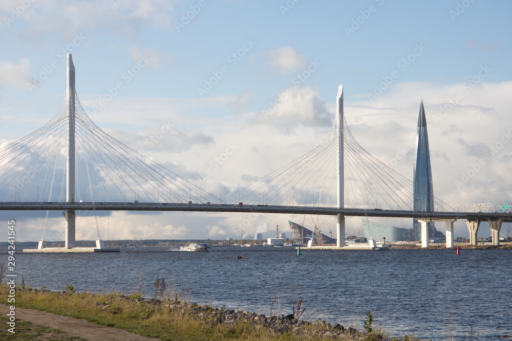 Cable-stayed bridge over a large river on a sunny day