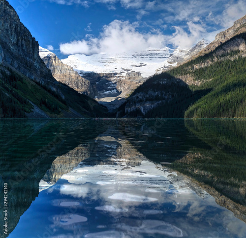 Fototapeta Naklejka Na Ścianę i Meble -  Lake Louise reflections in the morning.  Beautiful reflections of mountains and glacier over the lake in a calm water of alpine lake. Banff National Park.  Alberta. Canada
