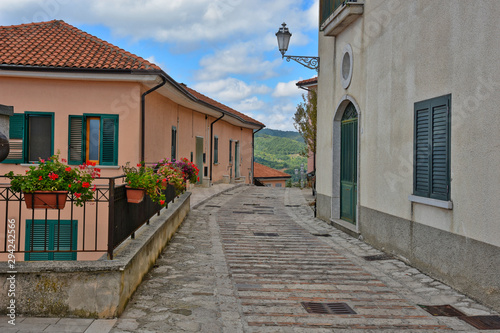 Morra de Sanctis  Italy  09 28 2019. The road between the houses of a quiet rural village  with typically Mediterranean architecture.