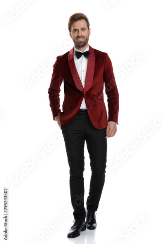 smiling young groom wearing red velvet tuxedo © Viorel Sima