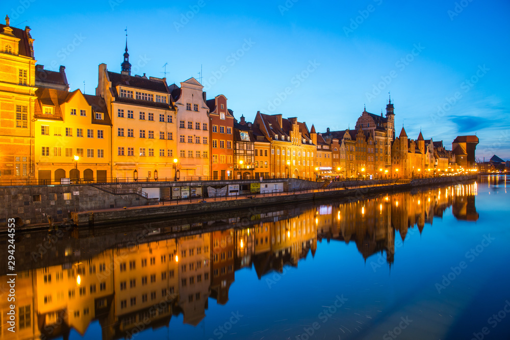 Obraz premium Gdansk at night with reflection in Motlawa river, Poland
