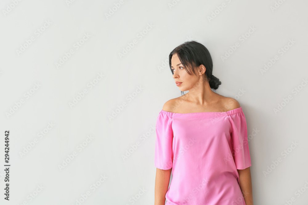 Portrait of beautiful woman on light background Portrait of beautiful woman on light background