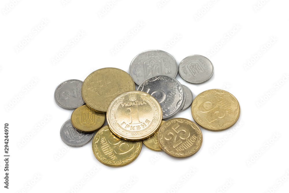 A silver and gold pile of coins from Ukraine, shot close up in macro against a clean, white background A silver and gold pile of coins from Ukraine, shot close up in macro against a clean, white background