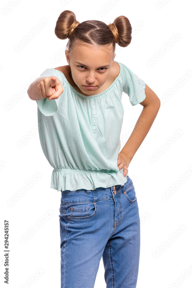 Aggressive angry Teen girl pointing finger on camera, isolated on white background. Emotional portrait of cute caucasian child looking at camera choosing you - accusing someone. Aggressive angry Teen girl pointing finger on camera, isolated on white background. Emotional portrait of cute caucasian child looking at camera choosing you - accusing someone.