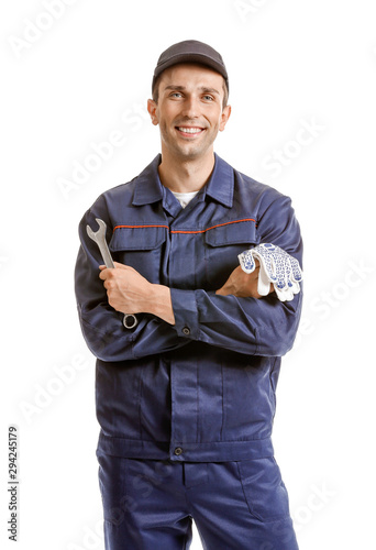 Male car mechanic on white ...