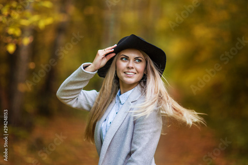 beautiful and happy girl in autumn park