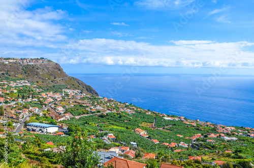 Amazing view of Arco da Calheta, Madeira Island, Portugal. Picturesque village located on a hill above the Atlantic ocean. Green banana plantations. Portuguese landscape. Tourist destination