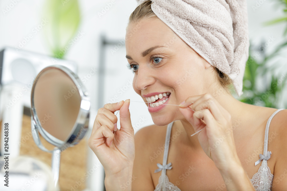 close-up of a woman with dental flossing close-up of a woman with dental flossing