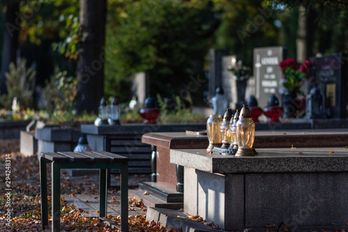 Autumn alley at the cemetery before the All Saints Day