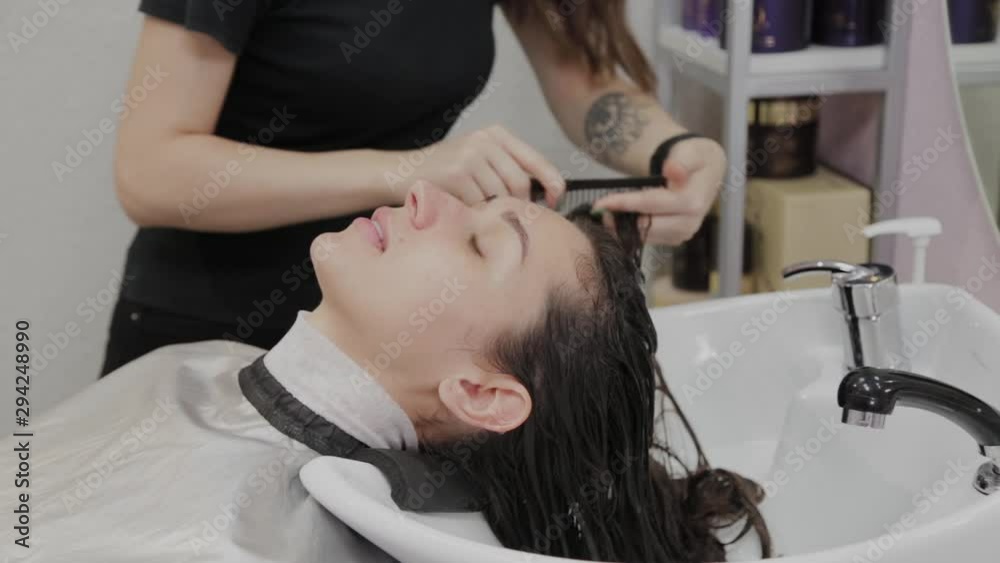 Beautiful young girl wash their hair at the hairdresser. Beautiful young girl wash their hair at the hairdresser.