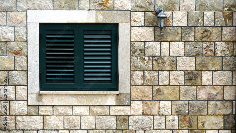 Window Shutters and Stone Facade.