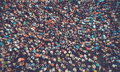 People crowd, aerial, top view. Toned image. © Dmytro