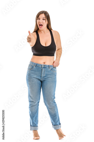 Young body positive woman showing thumb-up on white background