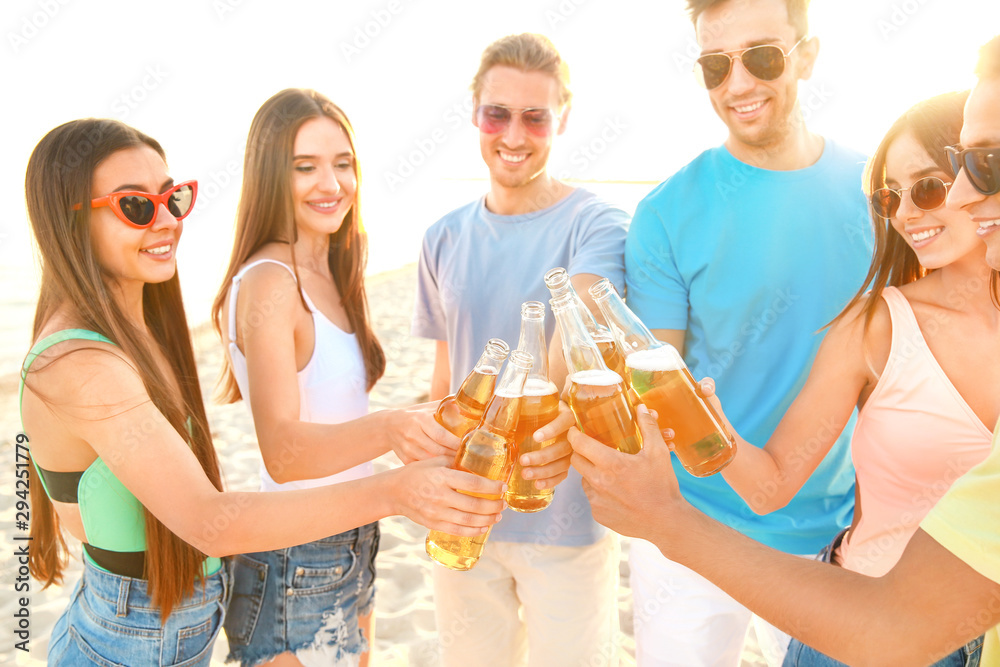 Friends drinking beer on sea beach Friends drinking beer on sea beach