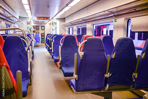 empty electric train blue and red chairs. no people