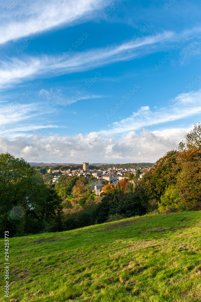 Tall view of Richmond, North Yorkshire and the castle with blue skies and autumn colors