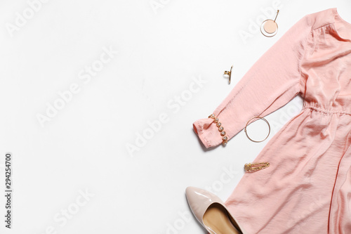 Modern female look with stylish accessories on white background