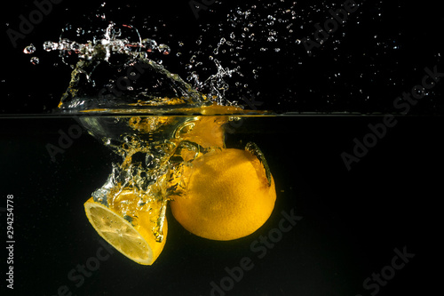 Lemon splashing into water © KrisP73