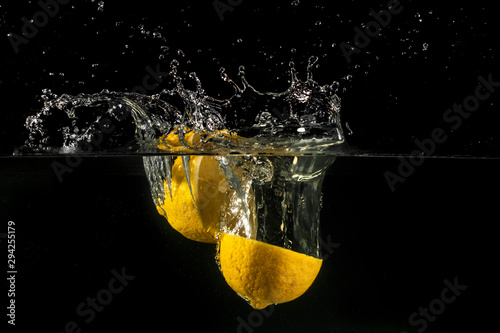 Lemon splashing into water © KrisP73
