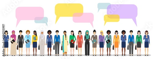 Group of women businesswomen standing together and speech bubbles on white background in flat style. Business team and teamwork. Different nationalities and dress styles. Concept of the opinion poll.
