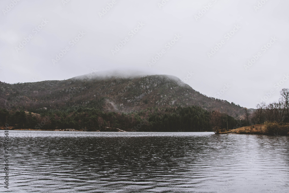 Norwegian landscape. Mountain in fog. Cloudy day.