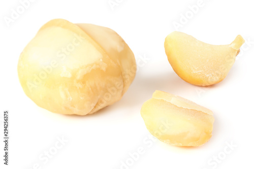 Macadamia nut with pieces isolated on a white background