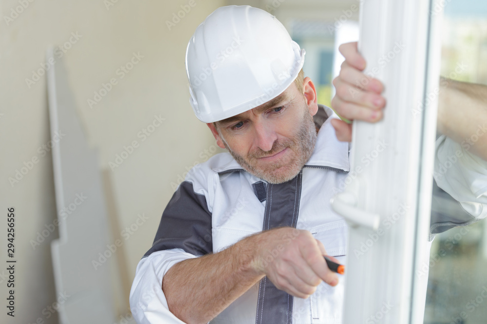 double glazing window installer fixing some defect