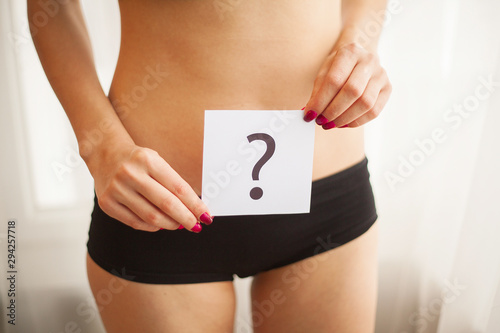 Health. Woman Body In Underwear With Question Card Near Belly