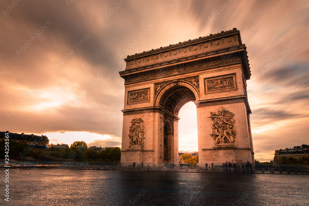 World famous Arc de Triomphe at the city center of Paris, France.
