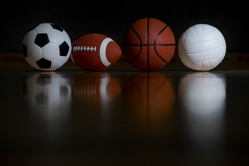 Close-up Of Various Sport Equipments Isolated On Black Background