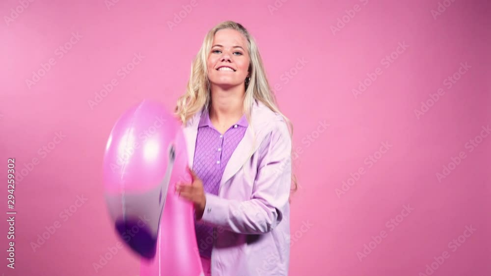 Teenage Girl Dancing With Inflatable Animal Teenage Girl Dancing With Inflatable Animal