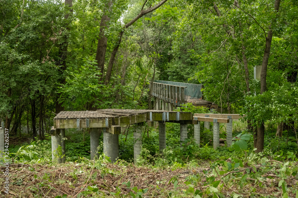 Abandoned old concrete bridge invaded by forest Abandoned old concrete bridge invaded by forest