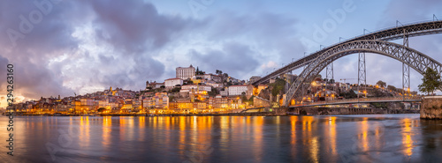 City of Porto at sunset, as seen from Cais de Gaia over Douro River © Angelino