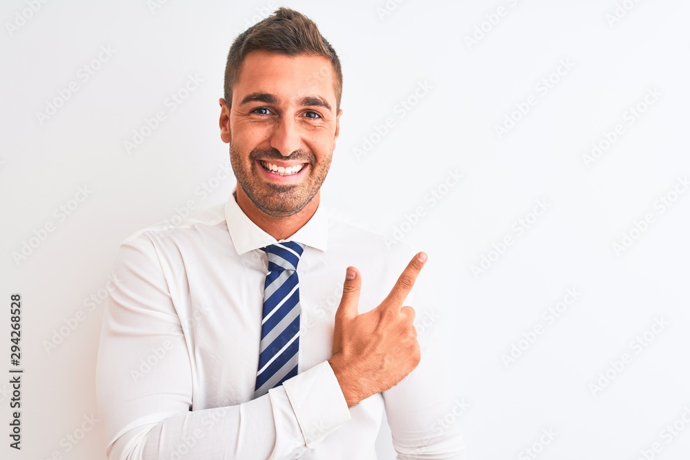 Young handsome elegant business man over isolated background cheerful with a smile of face pointing with hand and finger up to the side with happy and natural expression on face Young handsome elegant business man over isolated background cheerful with a smile of face pointing with hand and finger up to the side with happy and natural expression on face