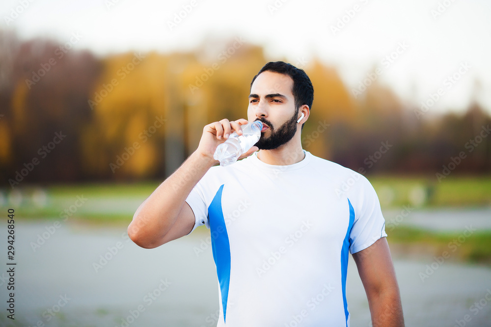 Fitness. Young man running in urban environment Fitness. Young man running in urban environment