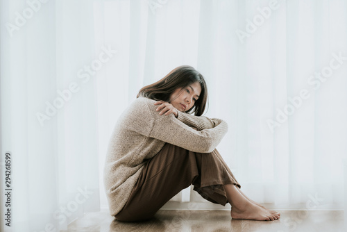 Bild auf Leinwand woman with depression sitting alone on the floor
